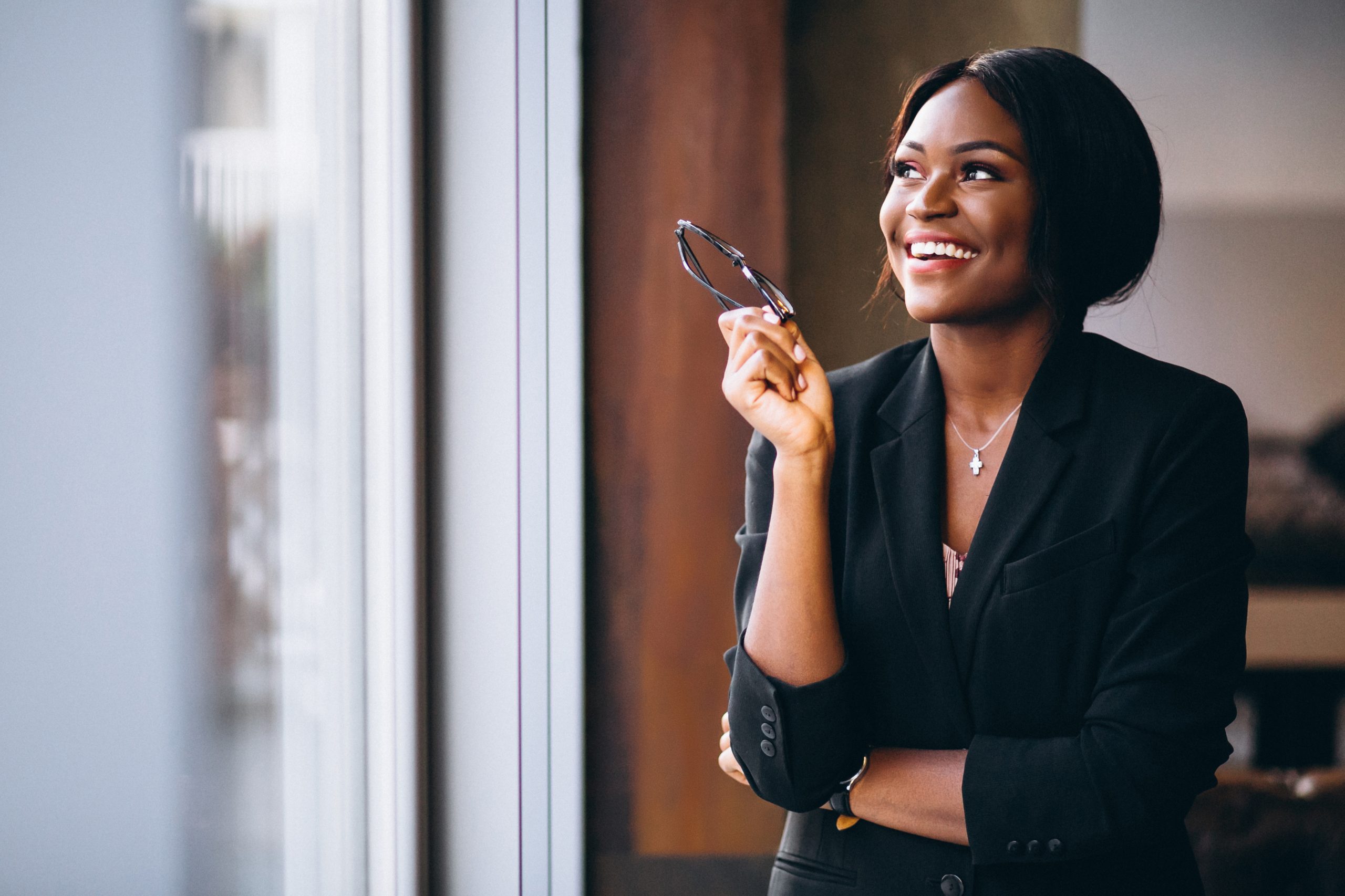 african american business woman by window 1 scaled.jpg