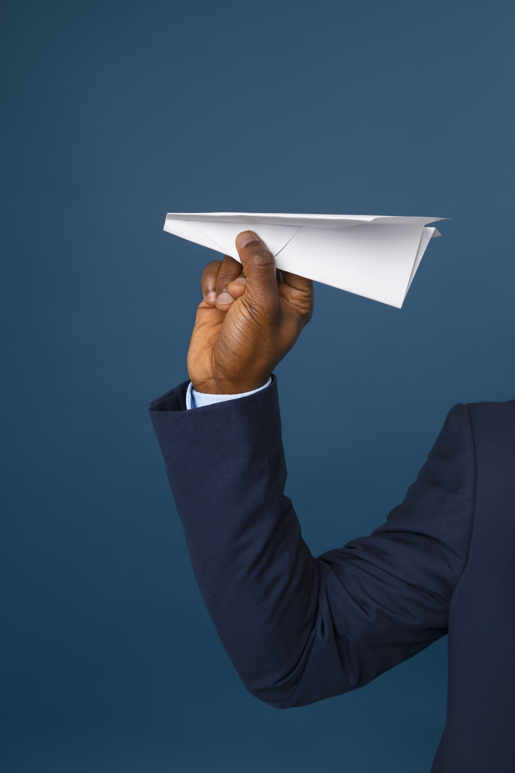 front view male flight attendant holding plane scaled