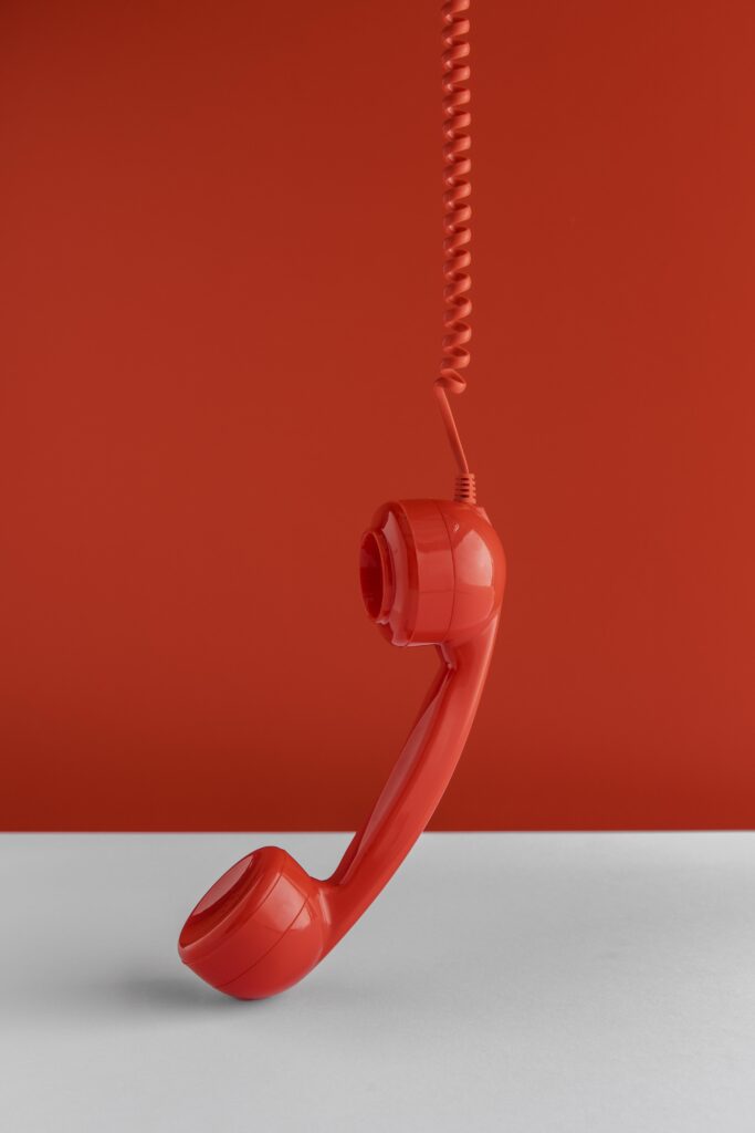 front view telephone receiver hanging from cord.jpg